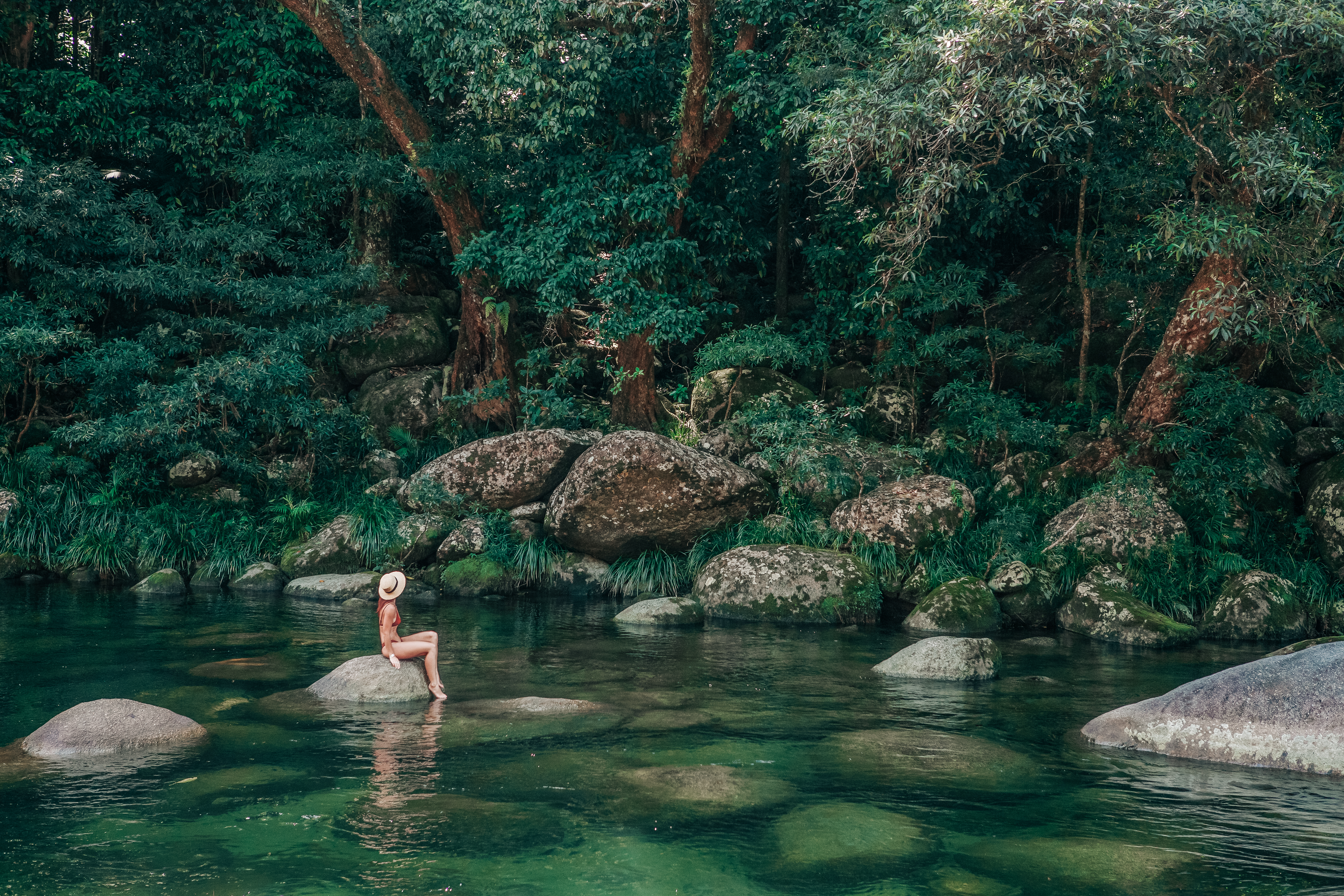Lady sitting on stone, Mossman Gorge